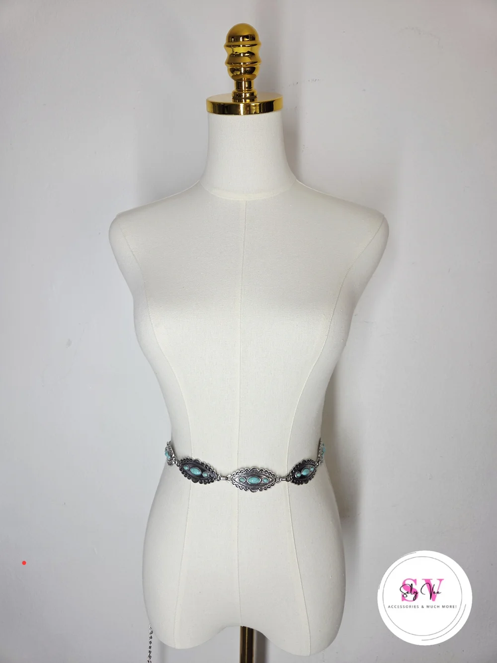 Silver-tone chain belt with turquoise stones.